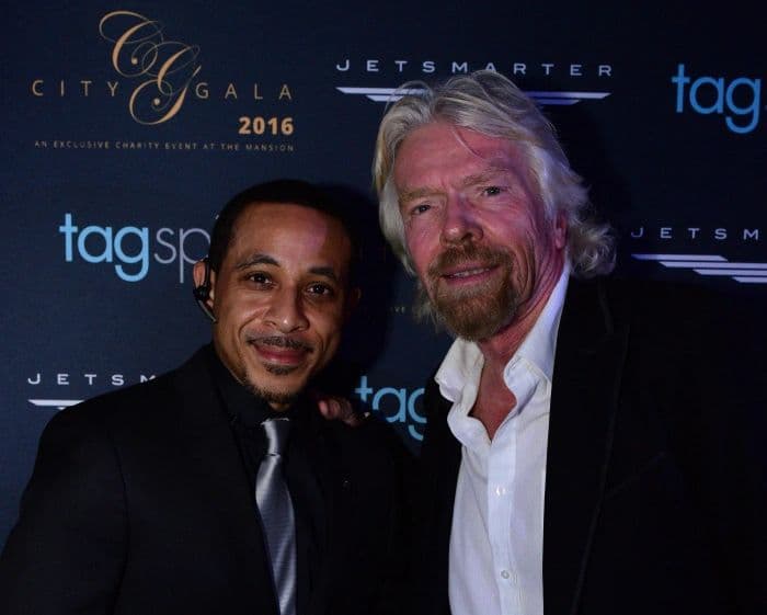 Two men at a gala step and repeat